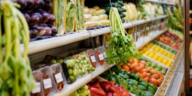 Fresh vegetables displayed in a grocery store.