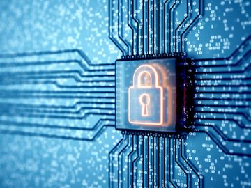 Glowing lock symbol on a circuit board representing cybersecurity and data protection.