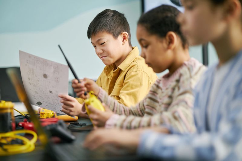 Young students participating in hands-on science projects, collaborating and learning through interactive experiments. STEM education promoting critical thinking and teamwork