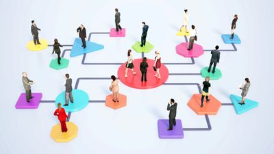 People connected on colorful geometric shapes representing networking.