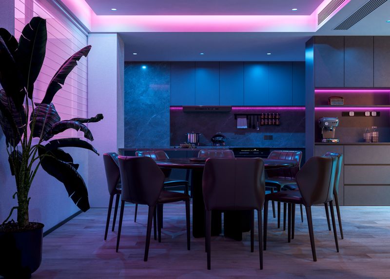 The kitchen is transformed by a romantic lighting mode, with hints of purple and blue hues creating a mystical and relaxing atmosphere. The contrast of darker tones and vibrant colored light produces an intimate and unique ambiance, ideal for evening gatherings. 3D render.