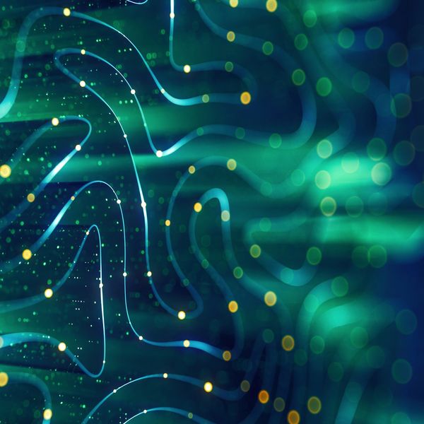 Abstract digital waves with glowing dots in blue and green hues.