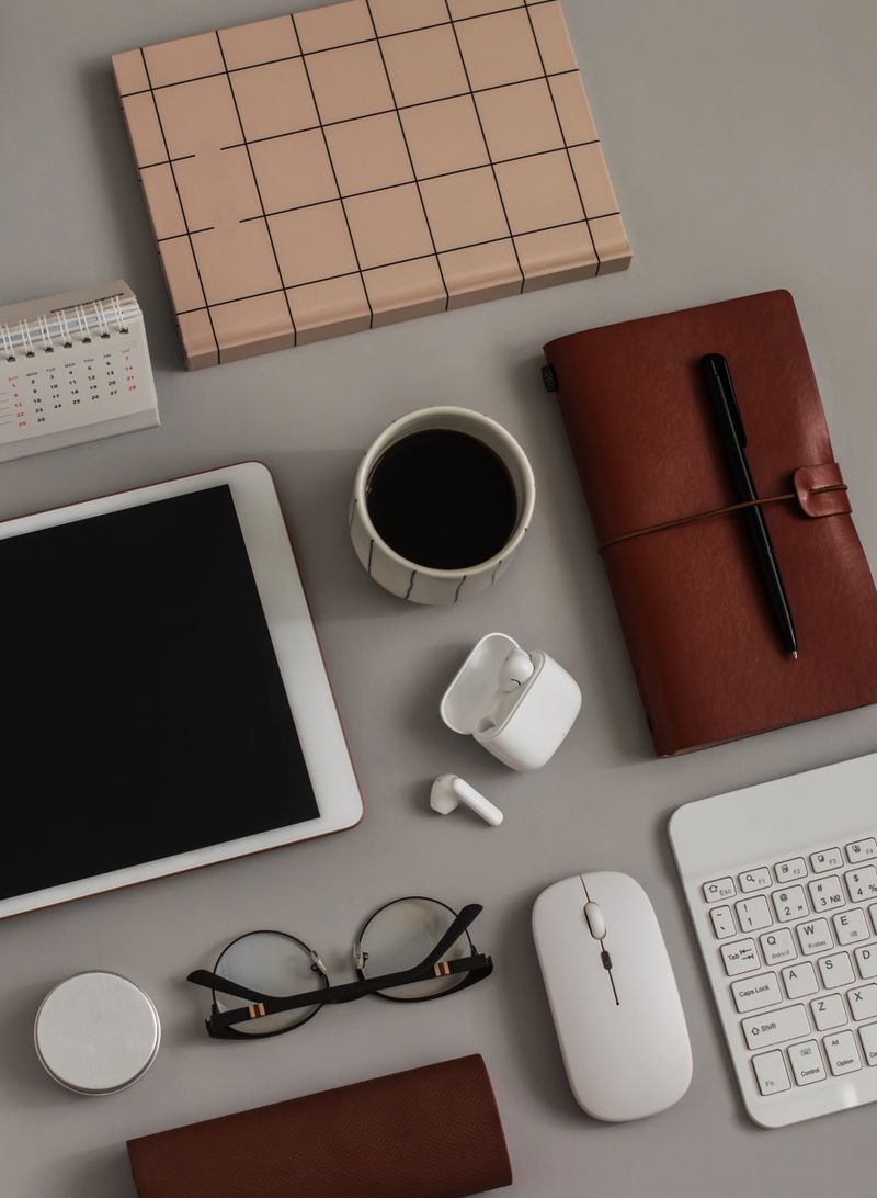 A office table with gadgets and accessories for studying and learning. Business, education, work concept