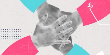 Three hands stacked together in unity with colorful design elements.