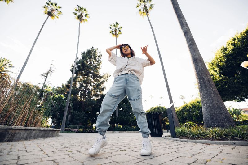 Woman dancing out in Beverly Hills streets dancing outdoors.