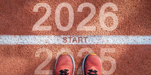 Shoes at the start line marking the transition from 2025 to 2026.