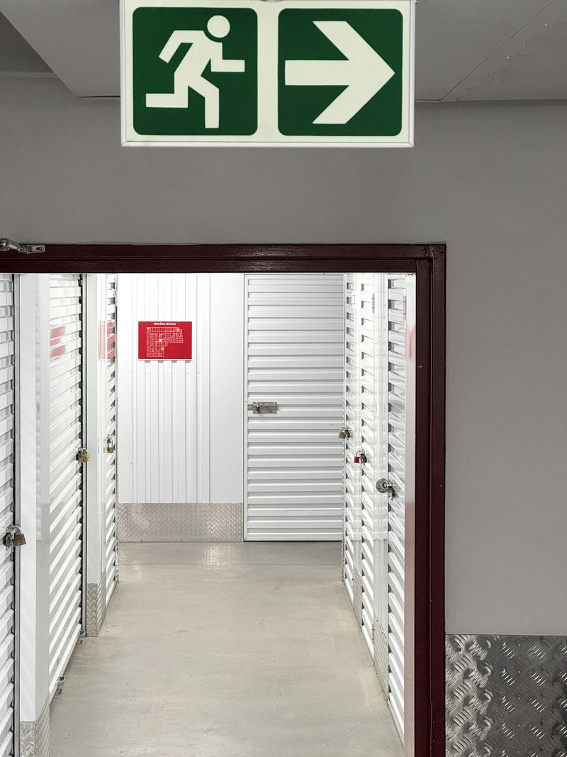 Emergency sign above the doorway inside a self storage unite building