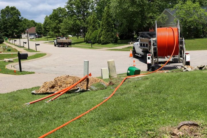 Fiber Optic Being Installed In A Lawn In A Residential Neighborhood