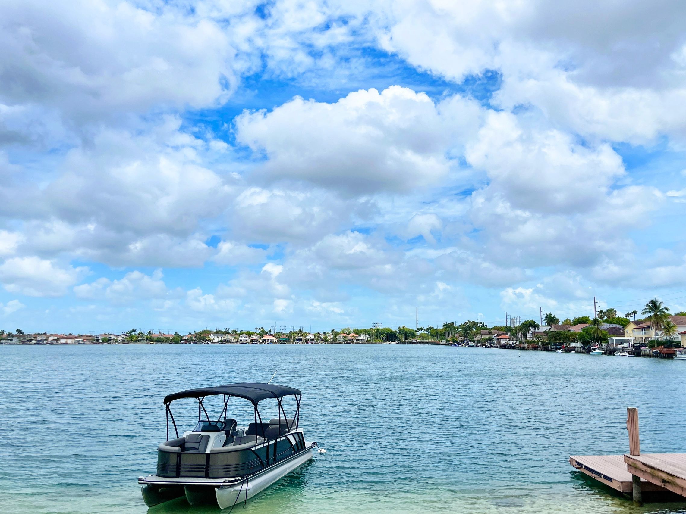 Pontoon boat on the water, ready for a marine audio upgrade