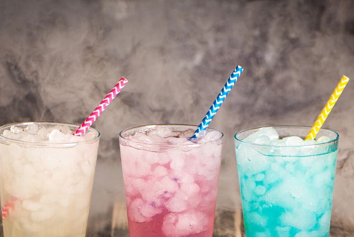 Three lemonades: one plain lemonade to the left, one pink lemonade in the middle, and a blue lemonad