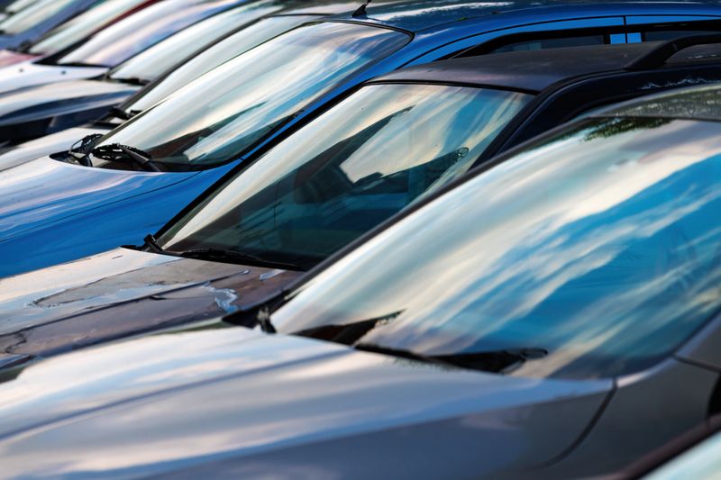 Used cars for sale parked on a parking lot of vehicle dealer, selective focus