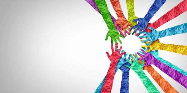 Colorful paper hands forming a circle symbolizing unity