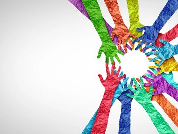 Colorful paper hands forming a circle of unity.