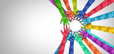 Colorful paper hands forming a circle against white background.