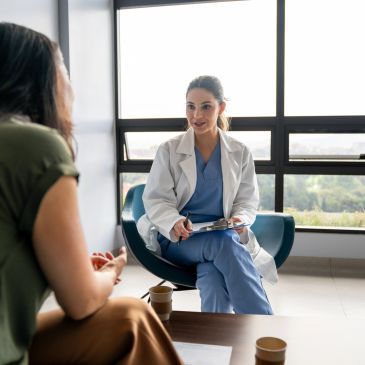 Doctor consulting with a patient in a modern office.