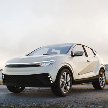 Sleek white electric SUV parked on a rugged terrain during sunset.