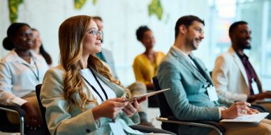 People attentively listening in a conference.