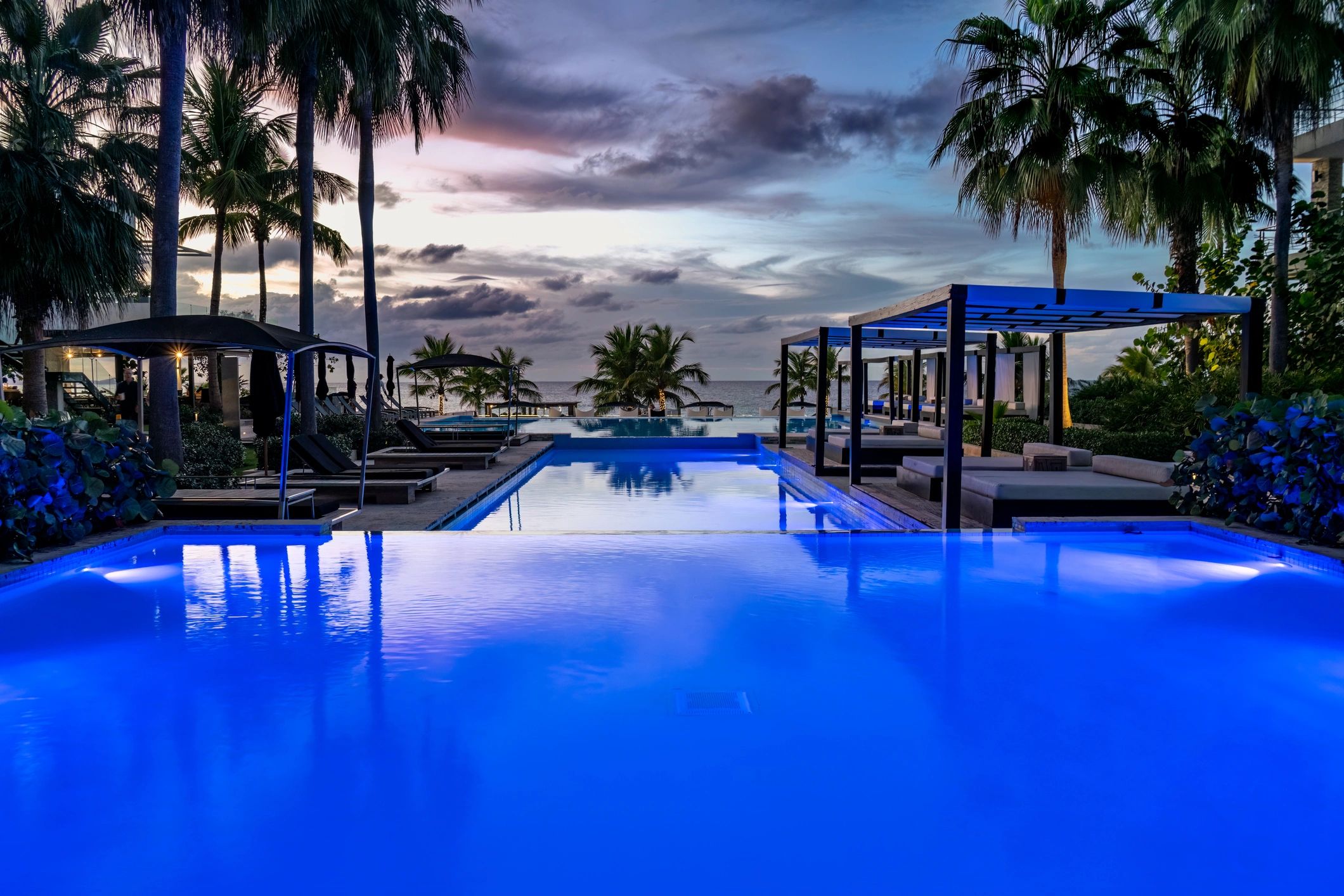 Elegant couple enjoying a luxurious poolside moment