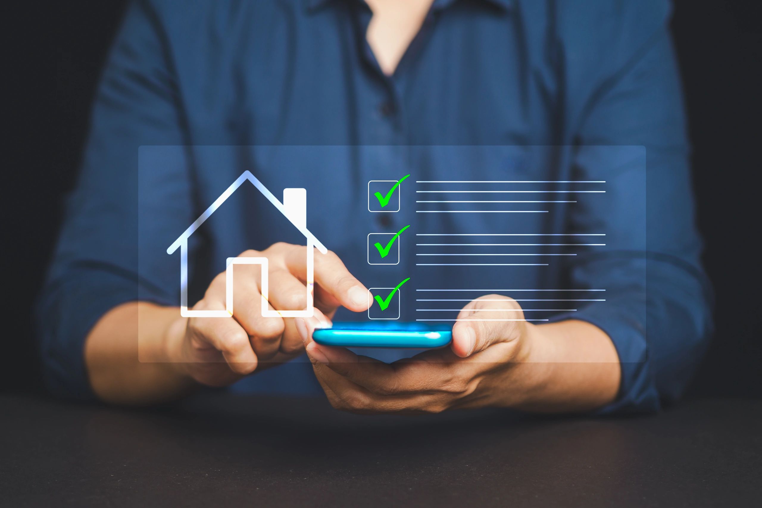 Person interacting with a digital checklist and house icon on a smartphone.