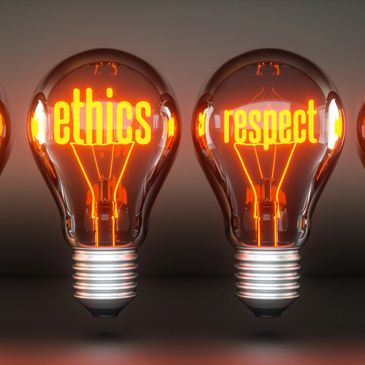Light bulbs glowing with the words ethics and respect inside.