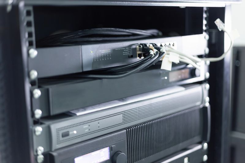 Network server storing data with connected cables in a data center
