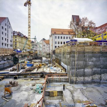 Construction site in an urban area with old buildings.
