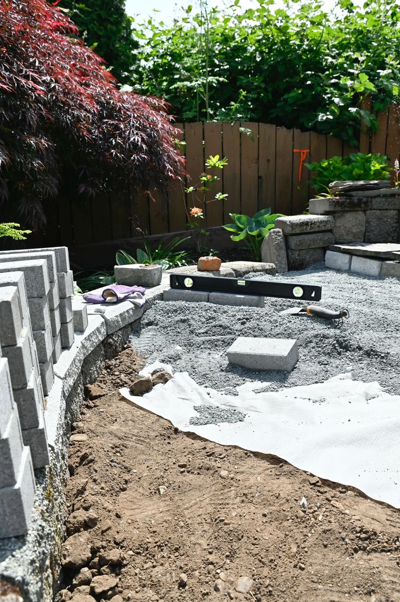 Outdoor home renovation hardscape gardening using rocks, blocks, gravel, dirt and other construction materials