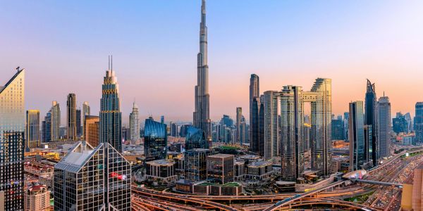 Skyline of Dubai at sunset with Burj Khalifa.
