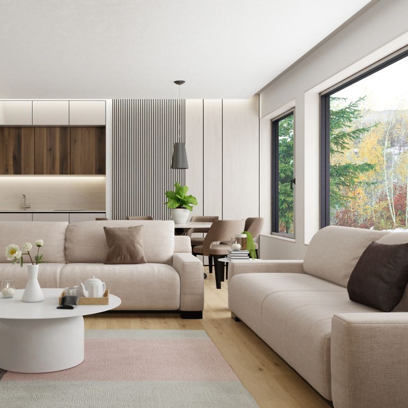 Modern Scandinavian apartment with open space concept featuring a cozy living room with sofa and armchairs, and a view toward the elegant dining area and kitchen. The design includes white wood wall paneling and warm pine hardwood parquet flooring, creating a light-filled, welcoming atmosphere. Ideal for promoting minimalist living, interior design, real estate listings, and architectural or furniture studio portfolios.