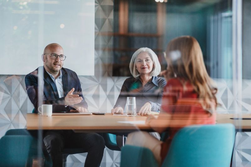 Business meeting in a glass room