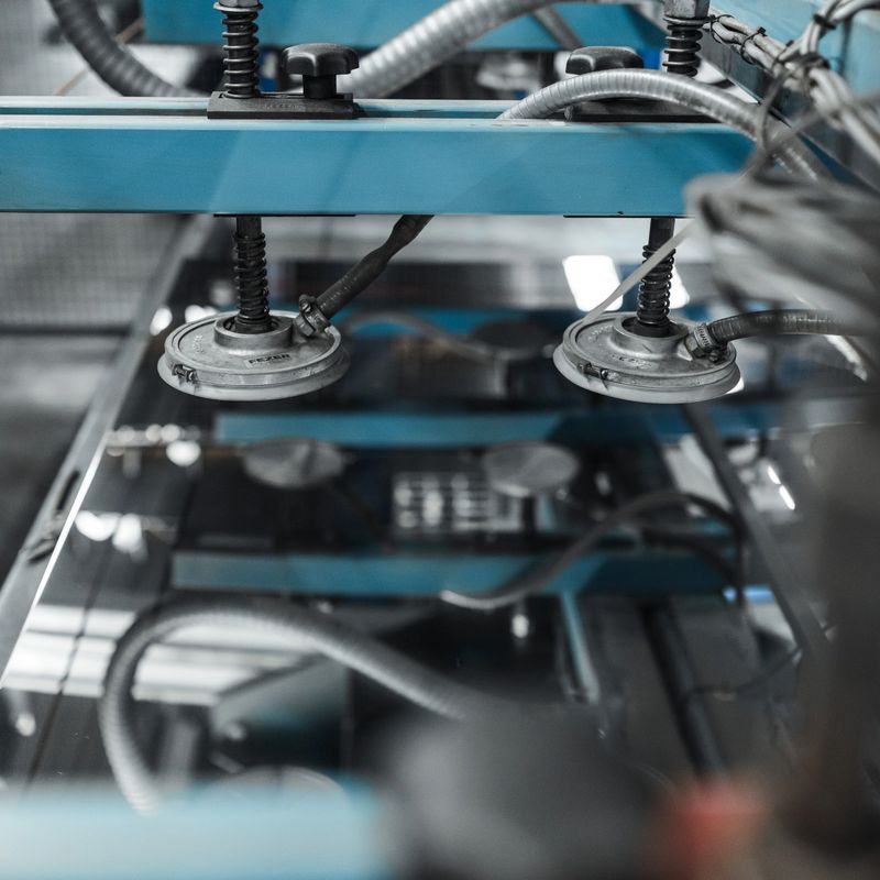 A series of high-resolution images capturing various stages of metalworking and industrial manufacturing. The photos showcase precision machinery, manual measurement with calipers, and industrial control systems used in a professional metal fabrication environment. These visuals reflect the core values of quality, efficiency, and craftsmanship in the modern metal industry, highlighting both advanced automation and skilled manual labor.