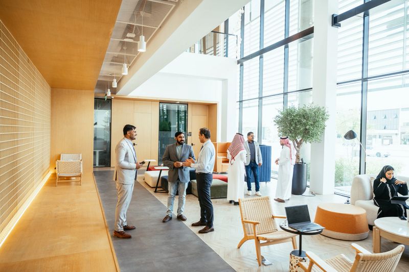 Diverse business people working together in modern bright office space