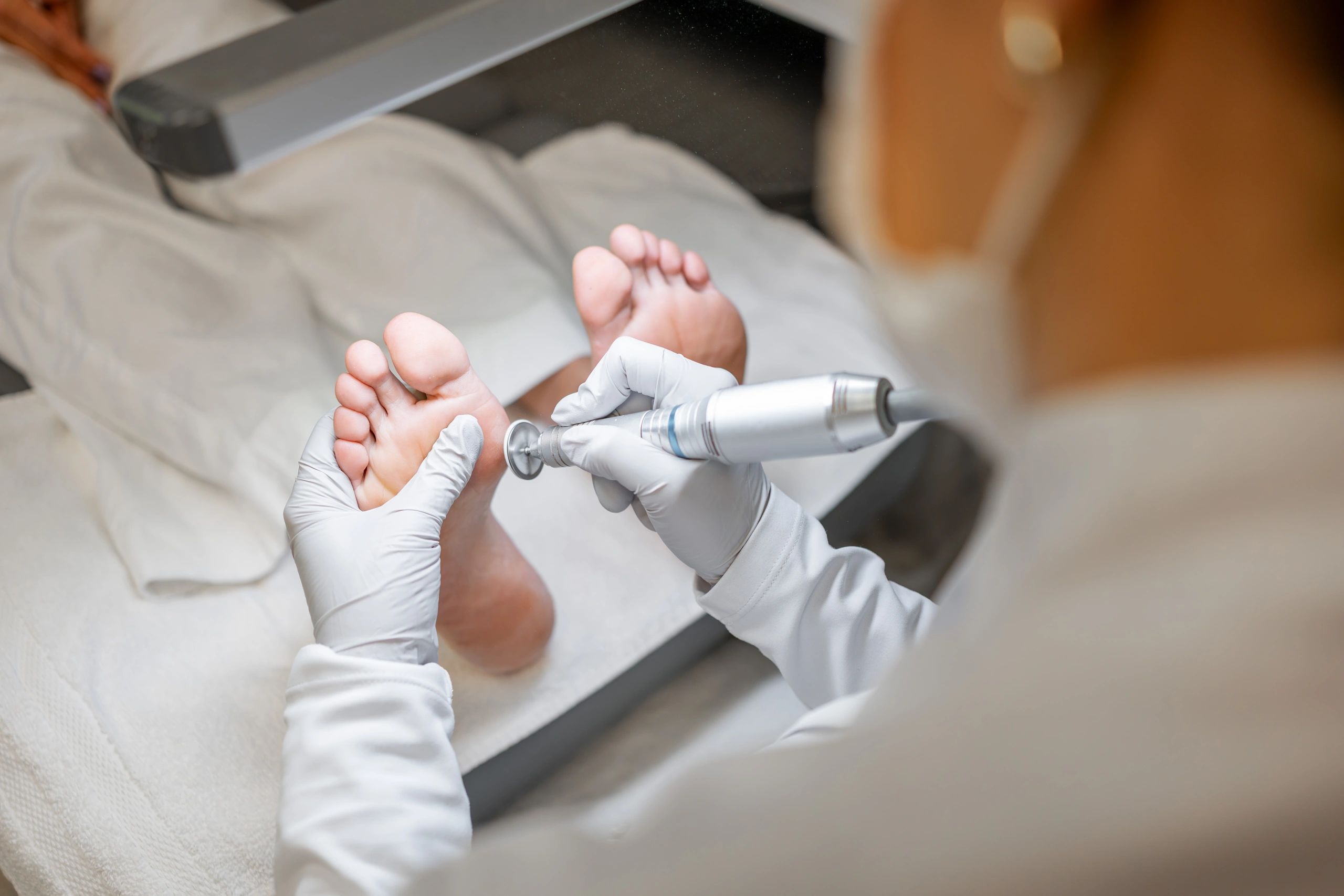Podiatrist explaining the procedure to the client