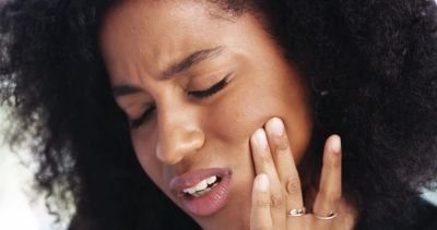 A patient with TMJ pain in the jaw.
