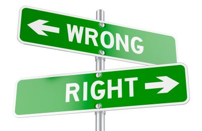Signposts indicating wrong and right directions.