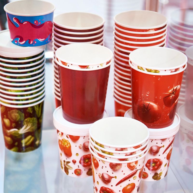 Disposable paper cups in cafe shop
