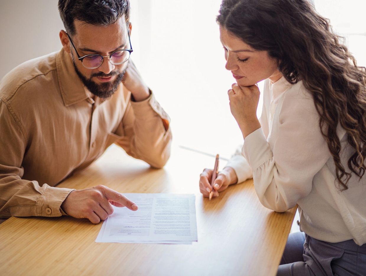 A man and woman sitting at a table reviewing documents in Yorba Linda, CA. 