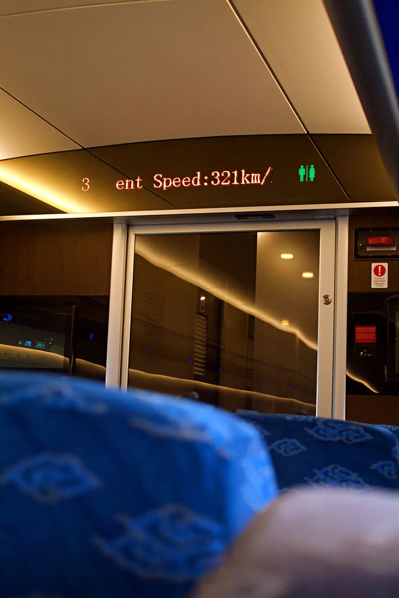 Luxurious interior of whoosh high-speed train with speed screen and cozy atmosphere