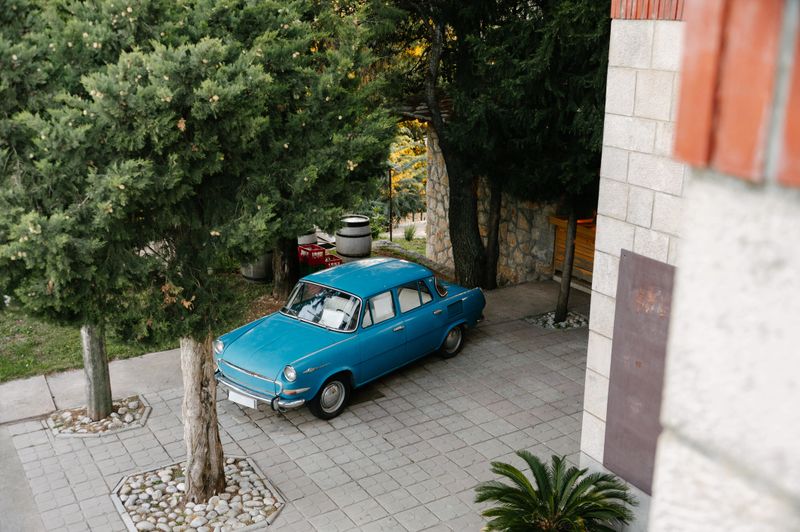 An old car in a yard