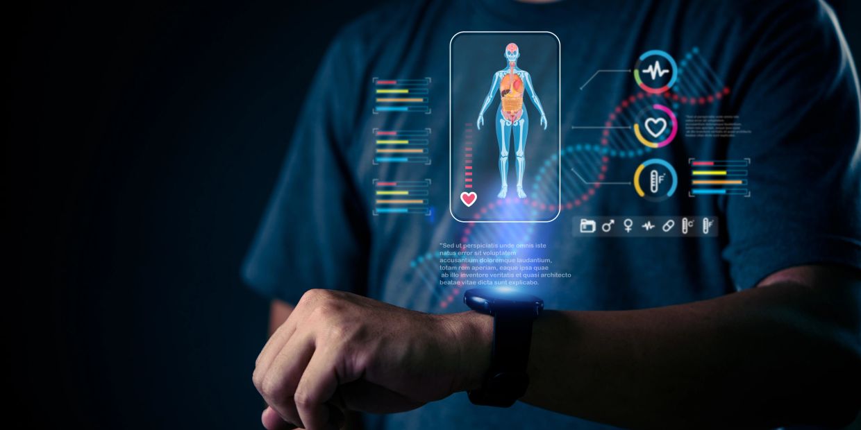 Person using a smartwatch displaying health data and a human body scan.