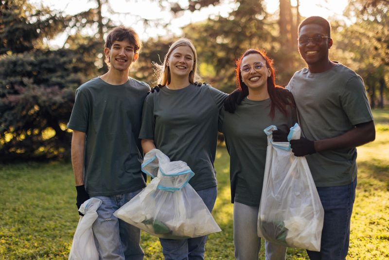 Portrait of a diverse group of confident environmentalists standing in a park after a volunteer cleanup