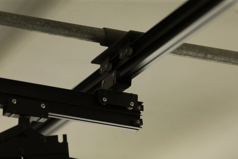 This detailed view shows a motion system rail and bracket, highlighting connection points that enable mechanical movement and offer support for various industrial applications