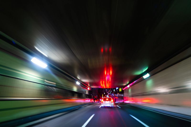 Speeding Car in Tunnel with Reflections – Tokyo Expressway
