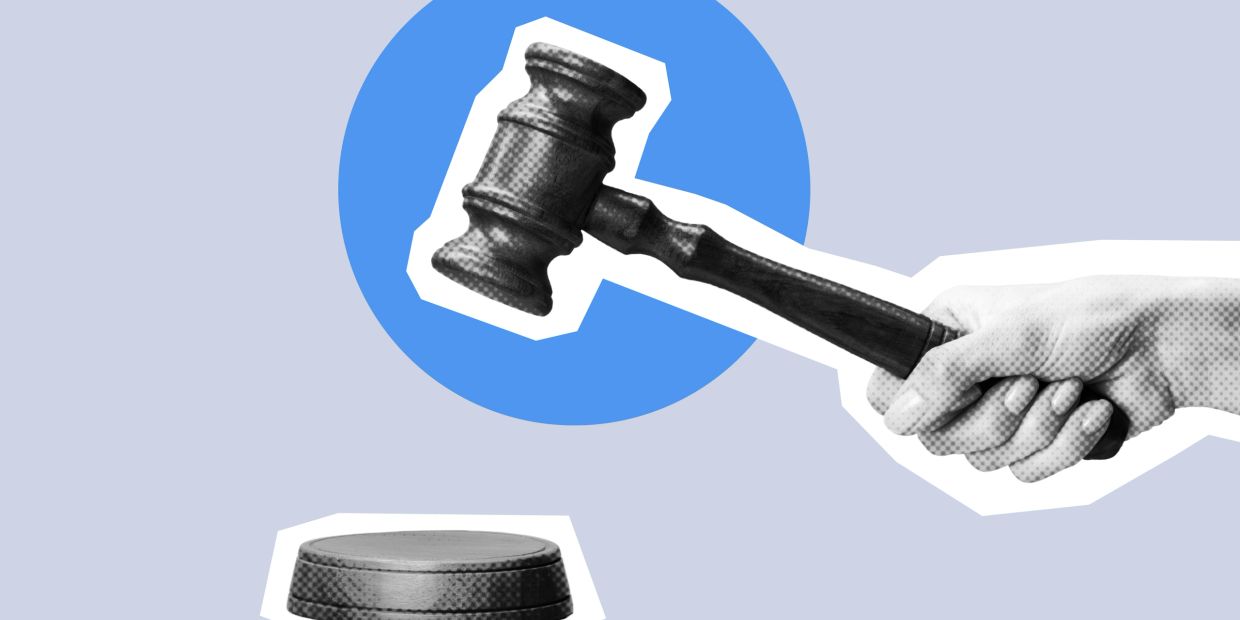 A hand holding a gavel above a block with a blue circle background.