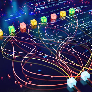 Colorful cubes connected by glowing wires over a digital circuit board.