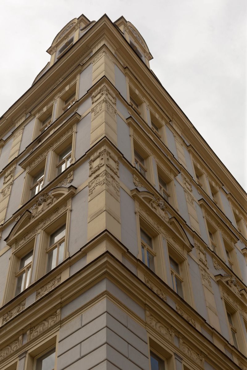 A closeup view capturing the stunning facade of a historic building, highlighting its intricate architectural details from a lowangle perspective, creating a striking visual experience