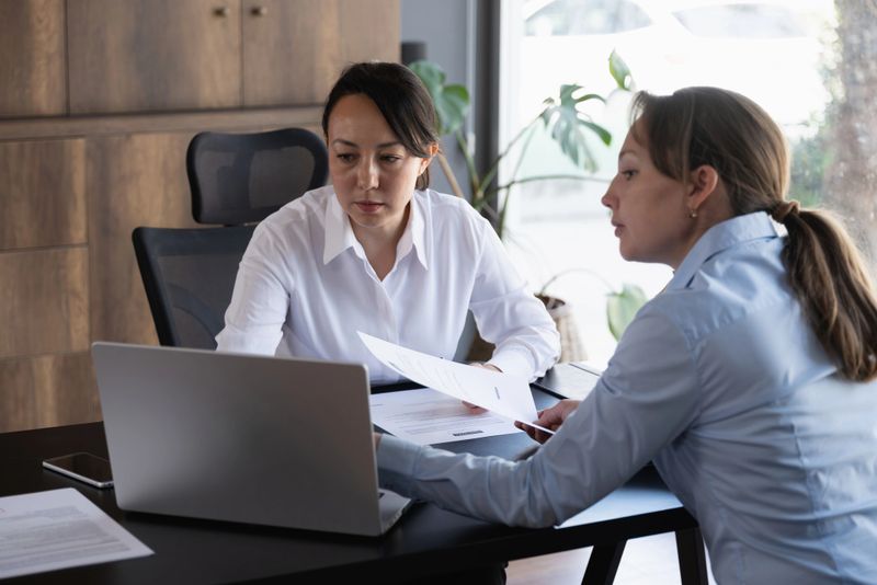 Female legal advisor lawyer helping her client with her legal issues in the office
