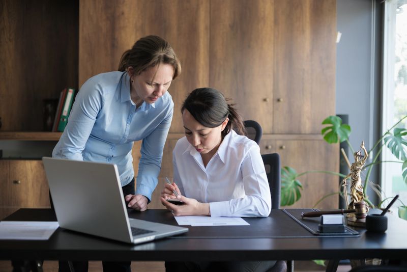 Female legal advisor lawyer helping her client with her legal issues in the office