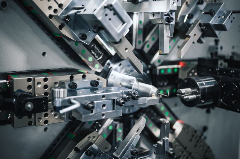Rotating lathe machine with robotic guidance in a smart manufacturing setup. Emphasizes precision machining, metal fabrication, and AI-driven automation related to robotics, CNC, machine tools, and industrial technology.