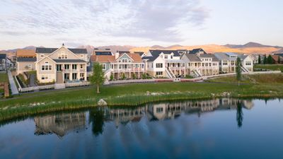 Apartment buildings near a lake with lots of happy tenants